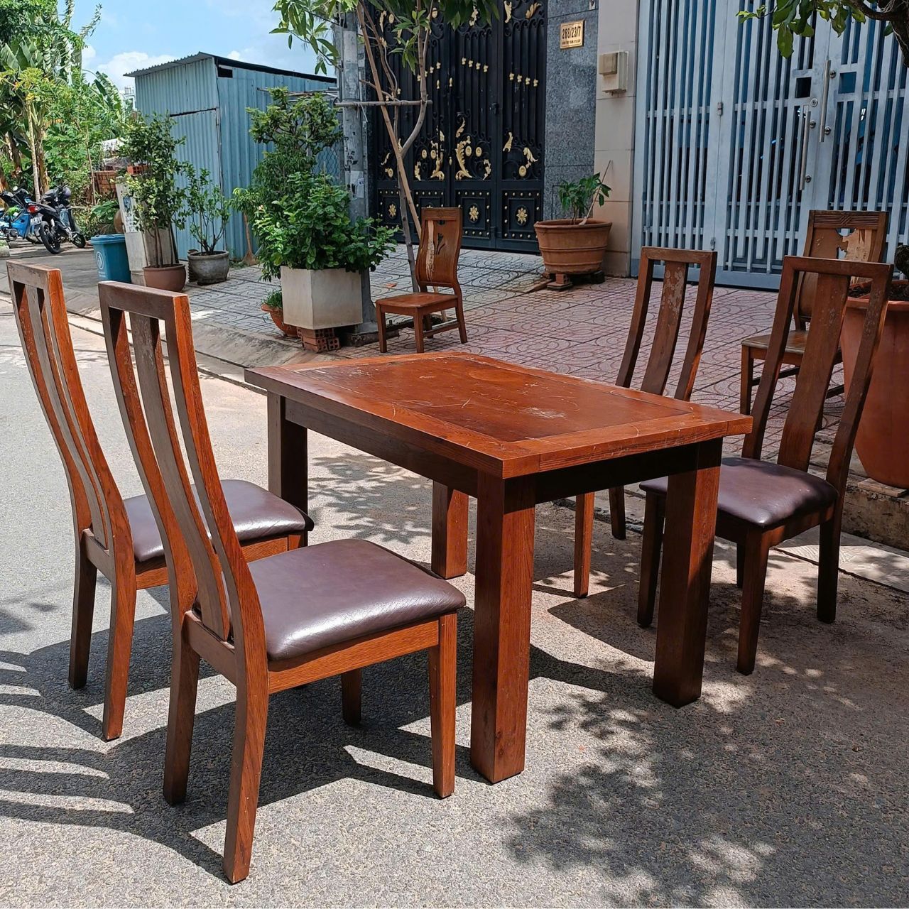 Bộ bàn ăn gỗ sồi 4 ghế mặt nệm da 1m2x80cm giá rẻ